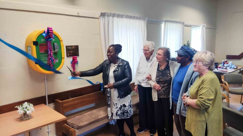 Paulette unveils the brand new defibrillator at St Chads Church